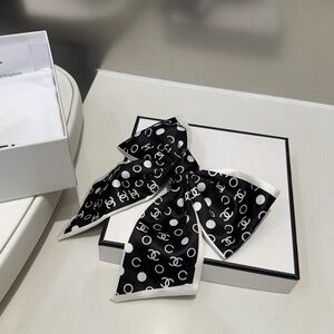 CHANEL Black and White Logo Bow Hair Clip